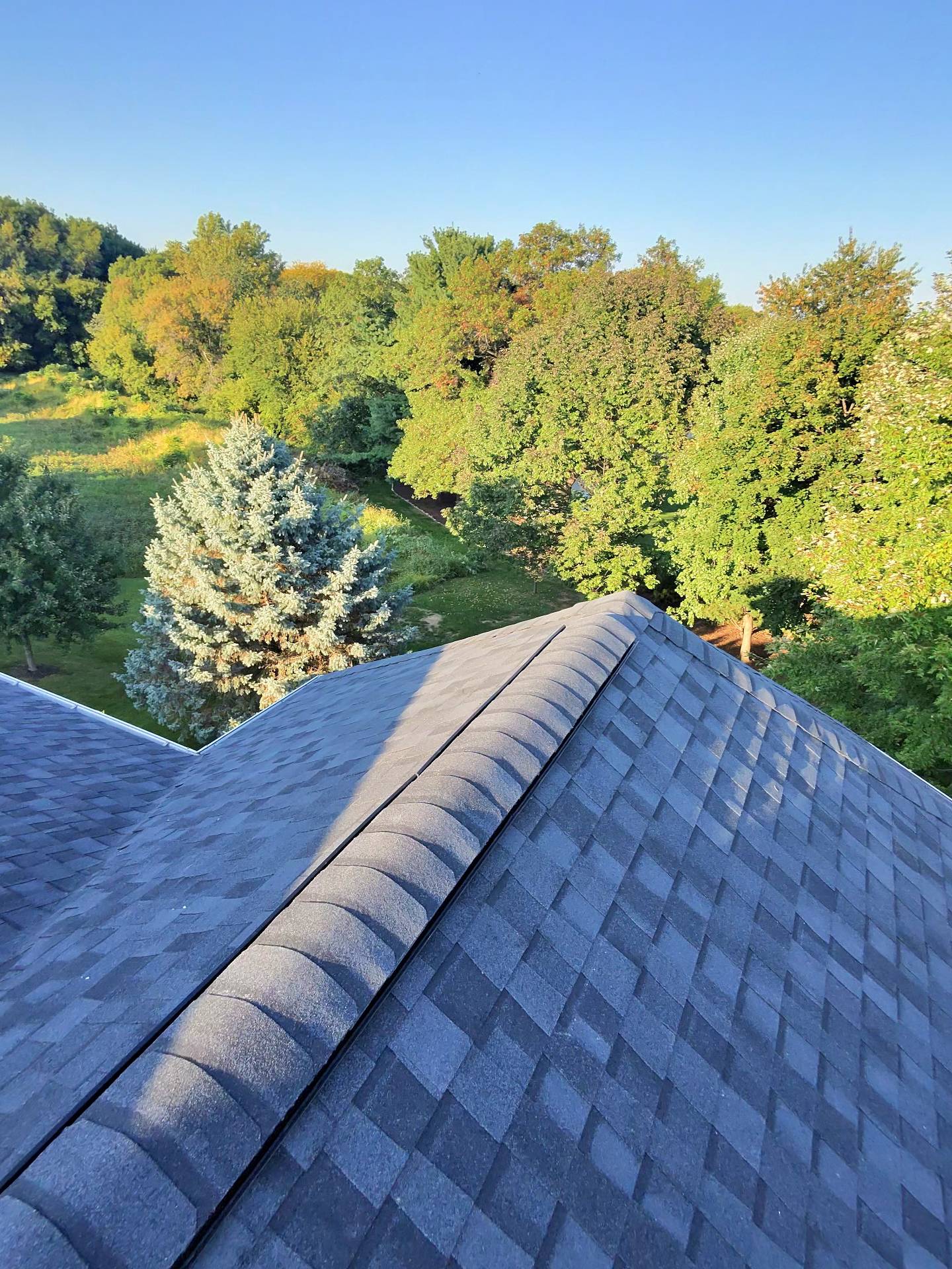 reroof_sun_vault_roofing_Madison_wi_east_side_moire_black_sunset_asphalt_shingle_20250922_close%20%282%29.jpg